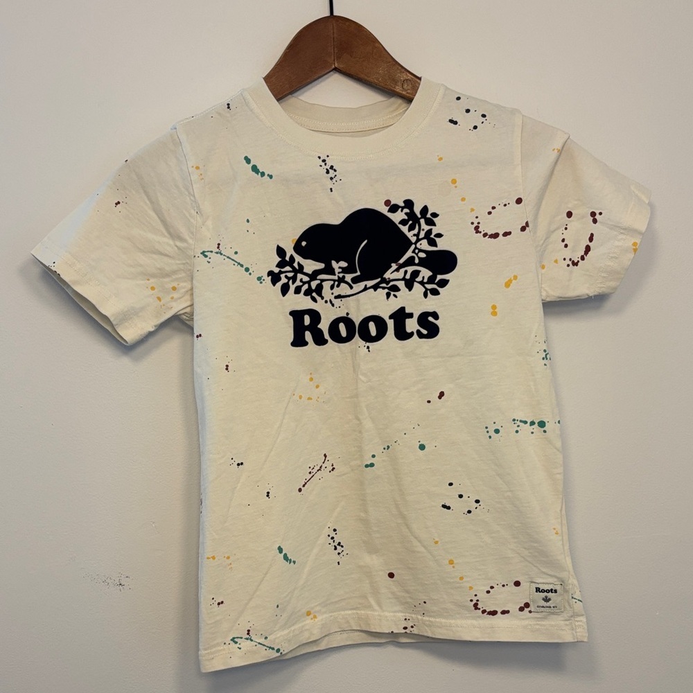 Roots Cream Short Sleeve Tee with Navy Beaver Graphic and Multicolor Splatter - Picture 1 of 2